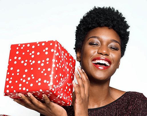 Woman holding red polka dot gift box